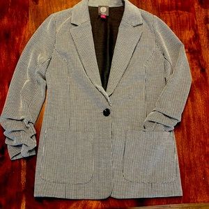 Versatile blazer that transitions from office to cocktails.
